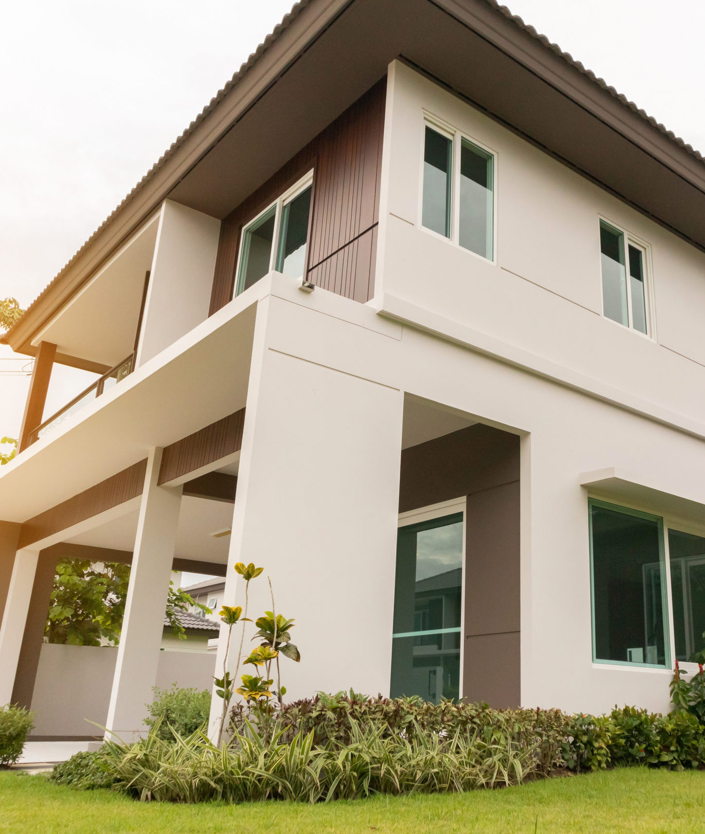 Beautiful modern house exterior with green grass